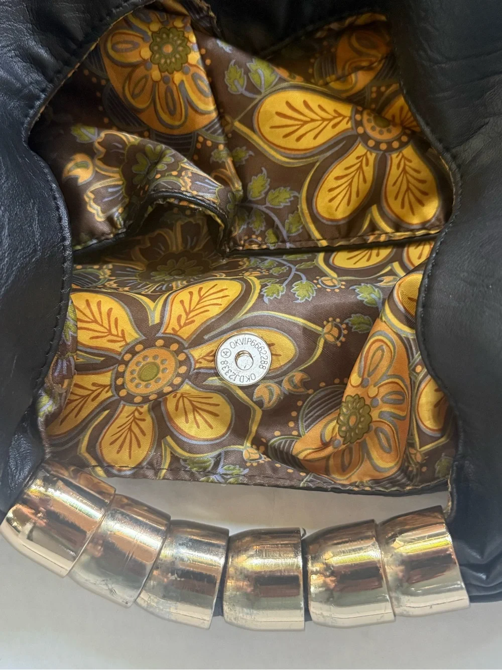 Black Leather Hobo Bag with Patterned Trim